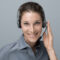 Smiling beautiful woman with headset: call center and customer support operator